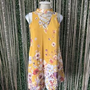 Charming Yellow Floral Sleeveless Dress with Crisscross Neckline